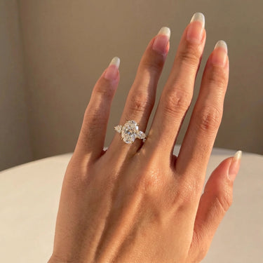 Oval Cut Three Stone Marquise Cut Side Stone Diamond Engagement Ring