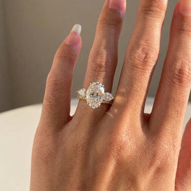 Oval Cut Three Stone Marquise Cut Side Stone Diamond Engagement Ring