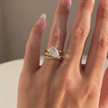 East West Pear Cut Diamond Ring With Triple Wrap Band