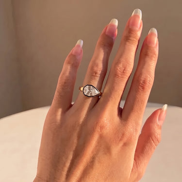East West Step Cut Pear Diamond Bezel Solitaire Engagement Ring