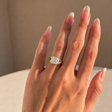 Emerald Cut Diamond Half Bezel Engagement Ring