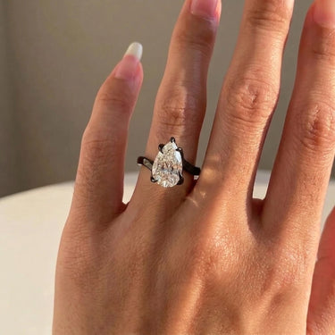 Pear Cut Diamond Thorn Engagement Ring In Black Gold