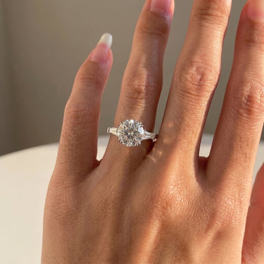 Round Cut 8 Prong Three Stone Baguette Cut Side Stone Diamond Engagement Ring